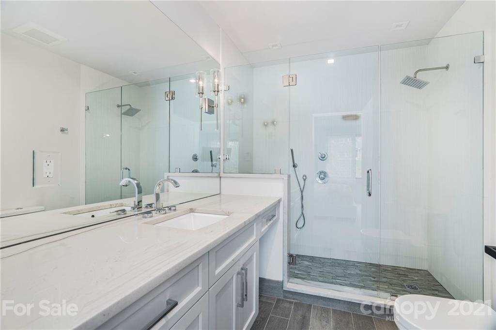 5201 Addison Drive Charlotte, NC 28211 - Photo 33 of 48 a bathroom with a sink a toilet and shower