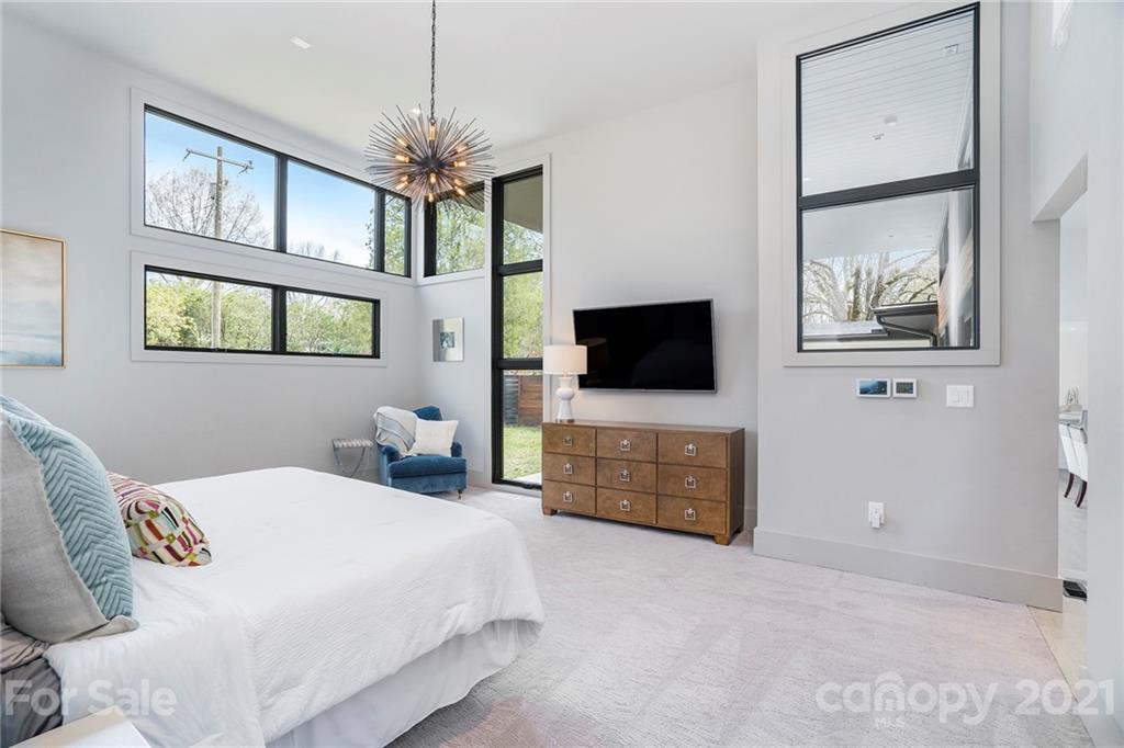 5201 Addison Drive Charlotte, NC 28211 - Photo 38 of 48 a bedroom with a bed and a flat screen tv