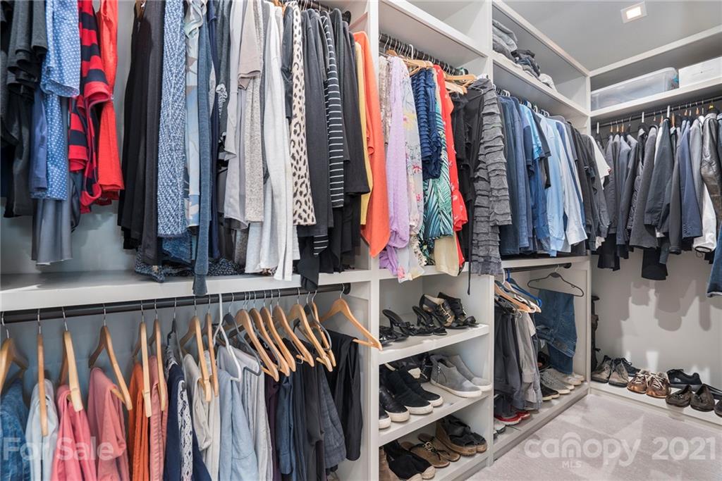 5201 Addison Drive Charlotte, NC 28211 - Photo 39 of 48 a view of walk in closet with clothes and shoes