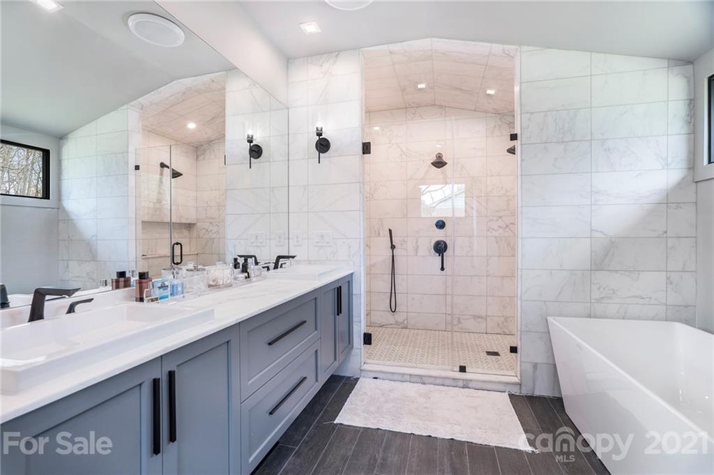 5201 Addison Drive Charlotte, NC 28211 - Photo 41 of 48 a bathroom with a tub sink double vanity and tub