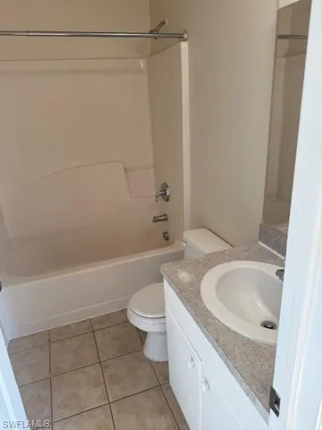 a bathroom with a sink a toilet and bathtub