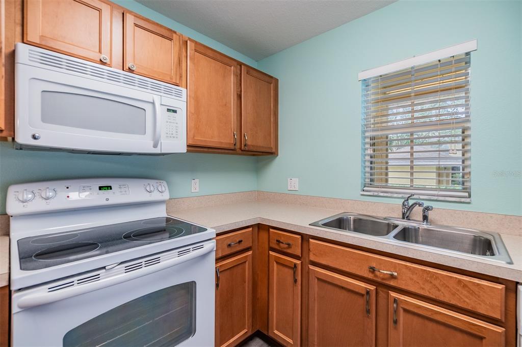 10906 Keys Gate Drive Riverview, FL 33579 - Photo 16 of 37 a kitchen with a sink cabinets and appliances