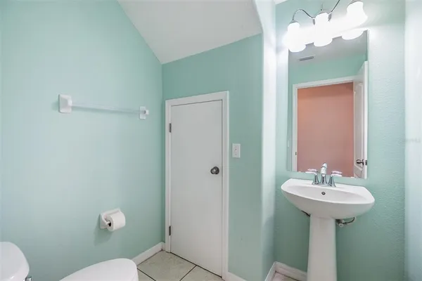 a bathroom with a sink toilet