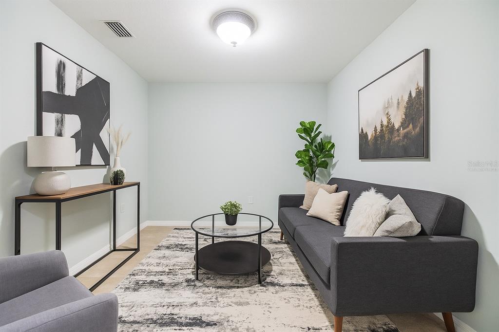 10906 Keys Gate Drive Riverview, FL 33579 - Photo 22 of 37 a living room with furniture and a potted plant