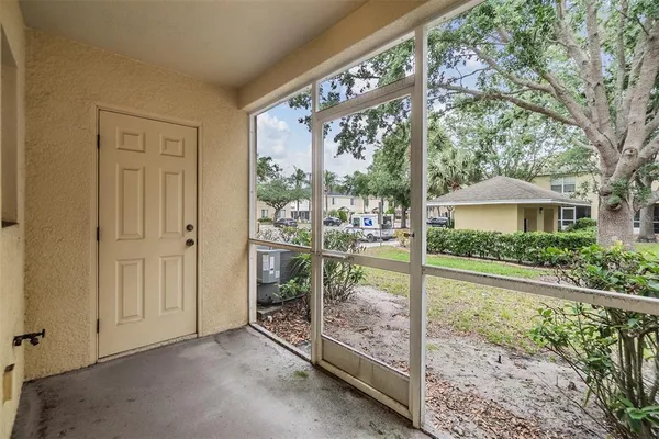 a porch with a bench in front of it