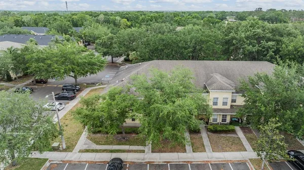 an aerial view of house with yard