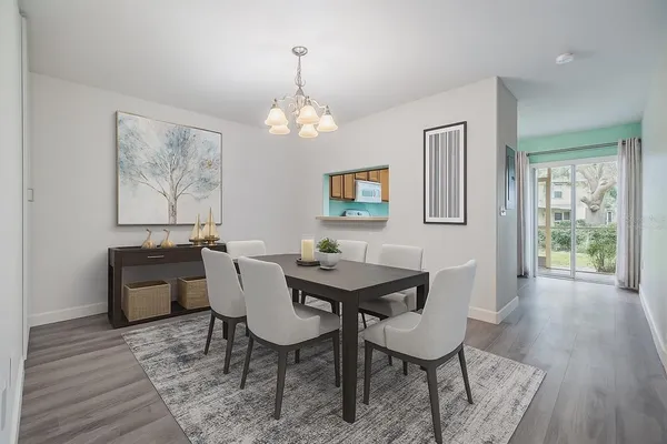 a view of a dining room with furniture window and wooden floor