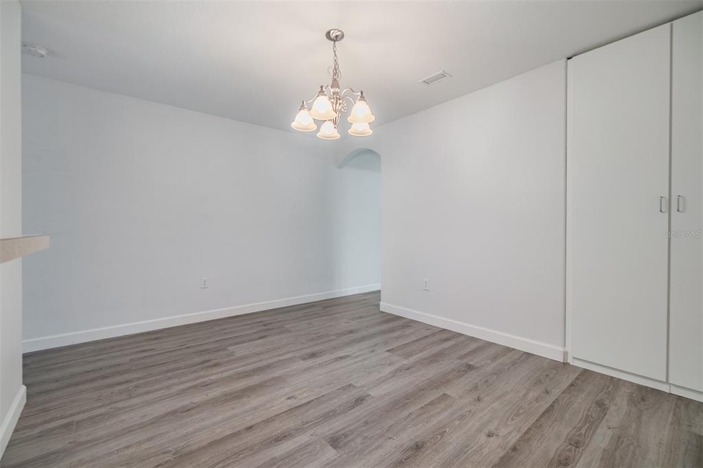 10906 Keys Gate Drive Riverview, FL 33579 - Photo 8 of 37 a view of an empty room with wooden floor