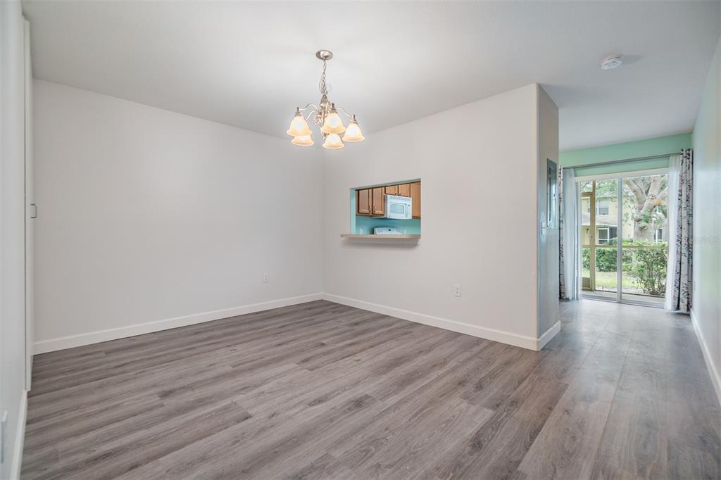 10906 Keys Gate Drive Riverview, FL 33579 - Photo 9 of 37 wooden floor in an empty room with a window