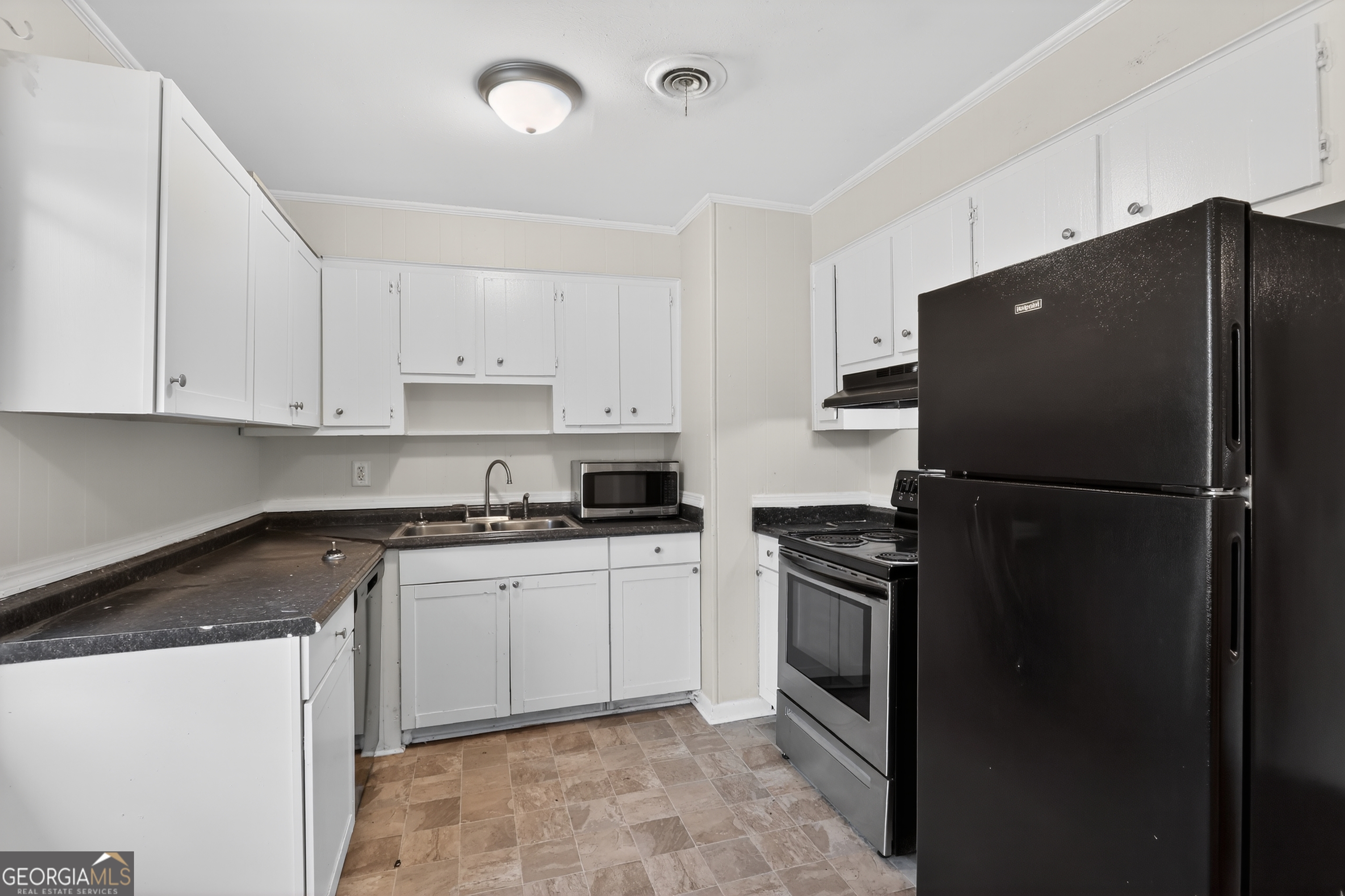 3606 Alene Circle Augusta, GA 30906 - Photo 15 of 30 a kitchen with a refrigerator sink and cabinets