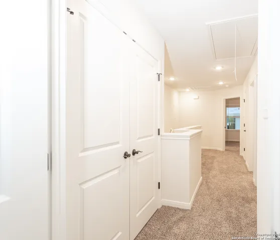 a view of a hallway with closet
