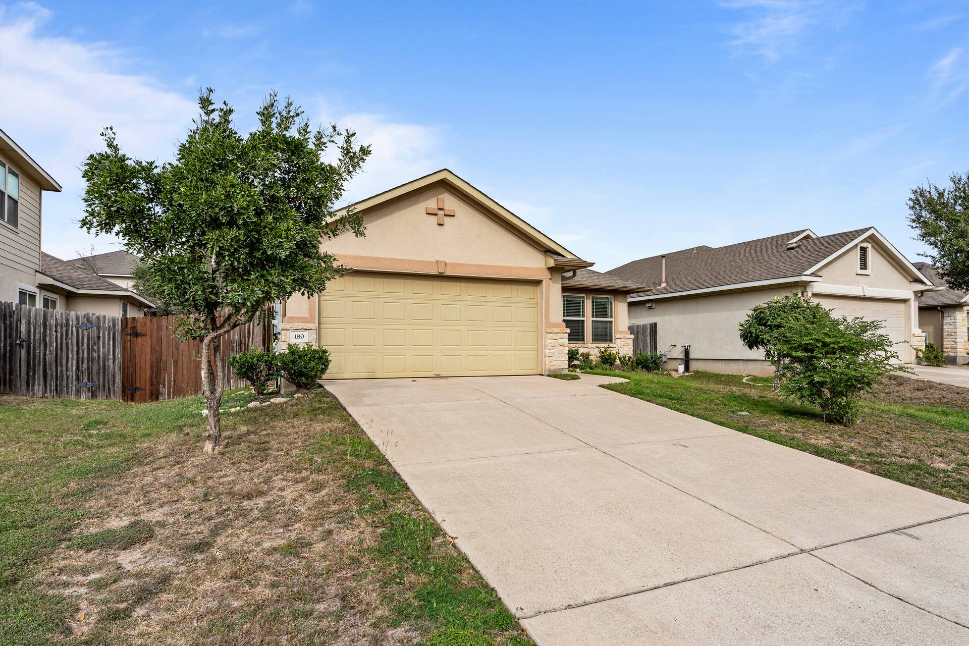180 Fletcher Bend Buda, TX 78610 - Photo 13 of 36 a front view of a house with garden