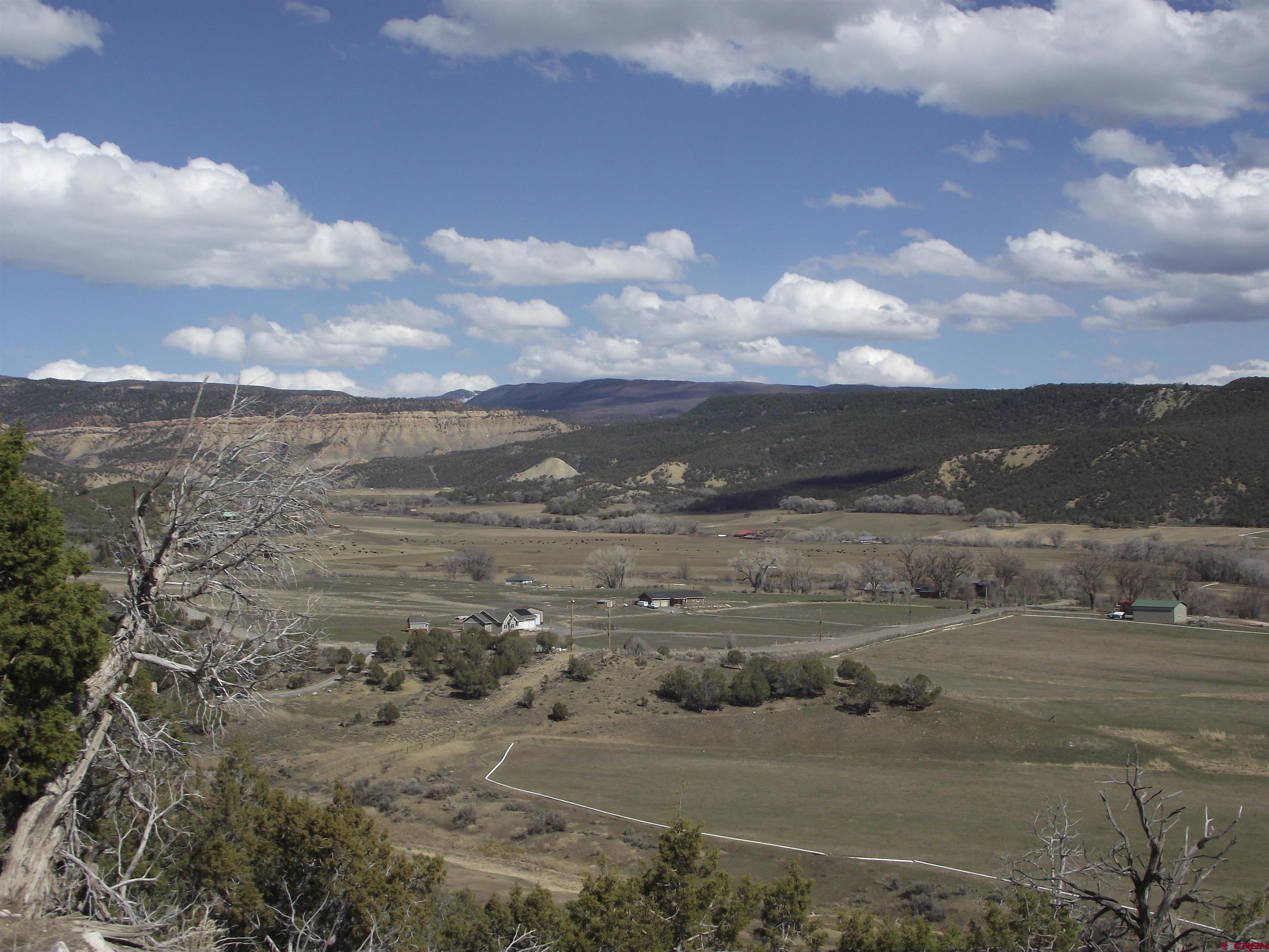 15842 Heavens View Road Cedaredge, CO 81413 - Photo 25 of 28 a view of a lake with mountains in the background