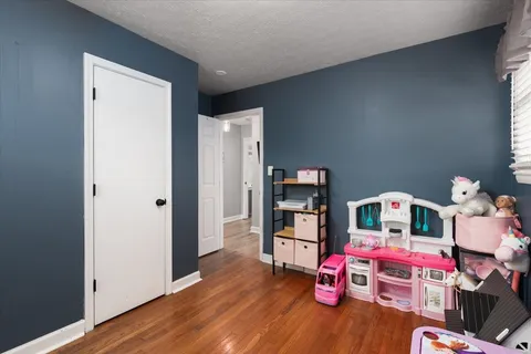 a room with toys and wooden floor