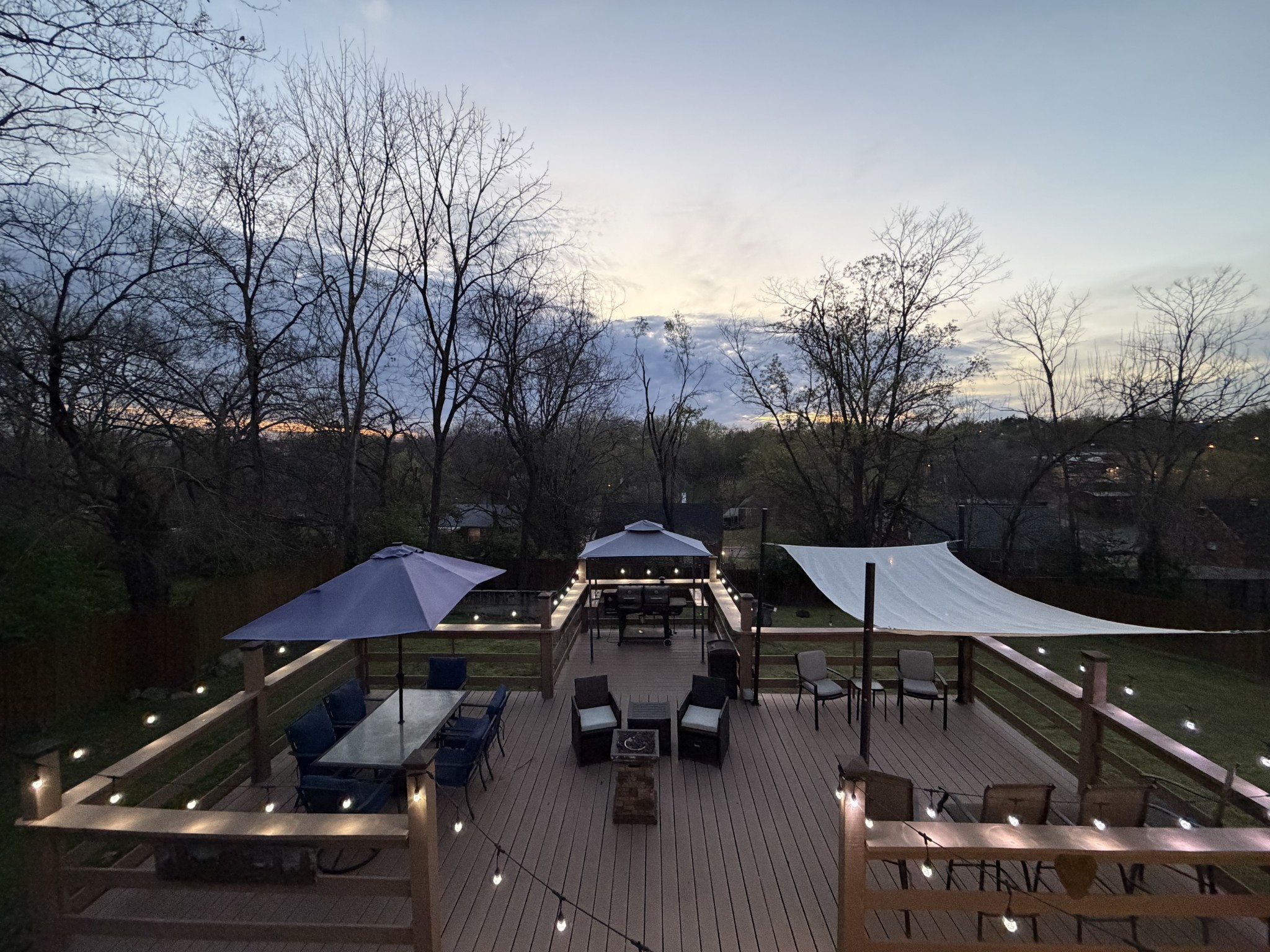 922 Potter Lane Nashville, TN 37206 - Photo 34 of 42 a view of a roof deck with table and chairs a barbeque with wooden floor and fence