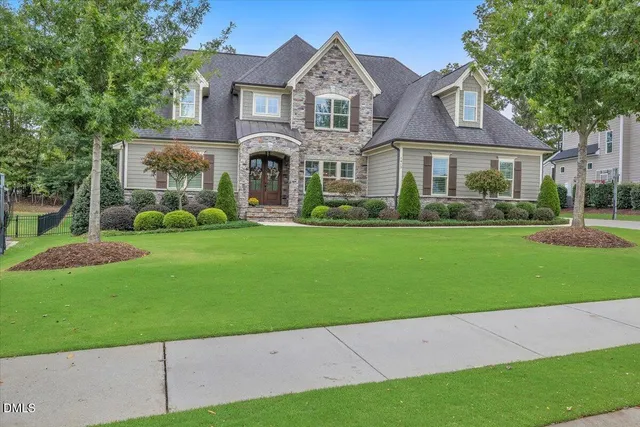 a view of entrance gate of a house with plants