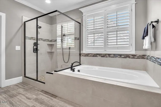 a utility room with a refrigerator and washer