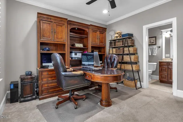 a spacious bedroom with a bed and a chandelier