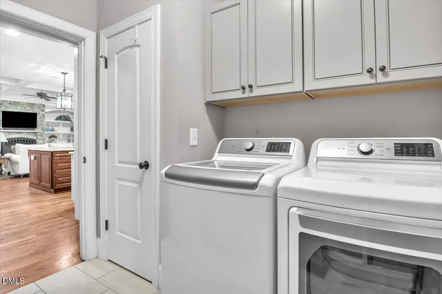 a view of a dining room with furniture wooden floor and a chandelier