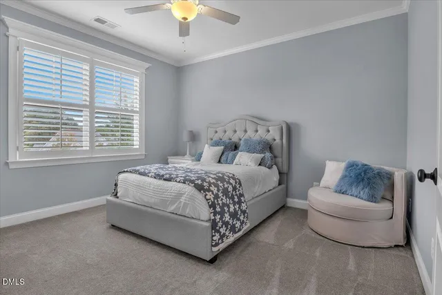 a front view of a house with a garden and patio