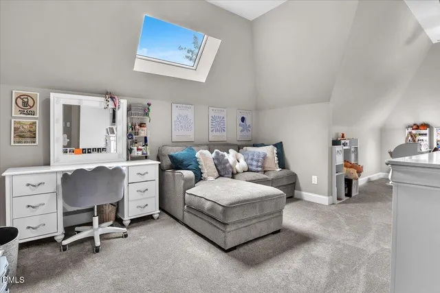 a view of a patio with a table and chairs