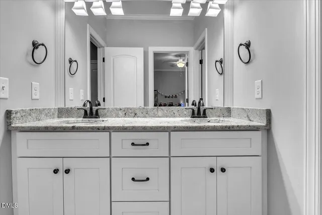 an aerial view of a house with garden space and street view