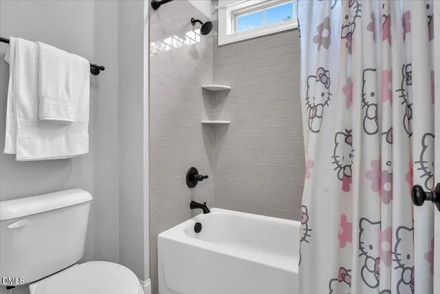 a view of a house with backyard sitting area and garden