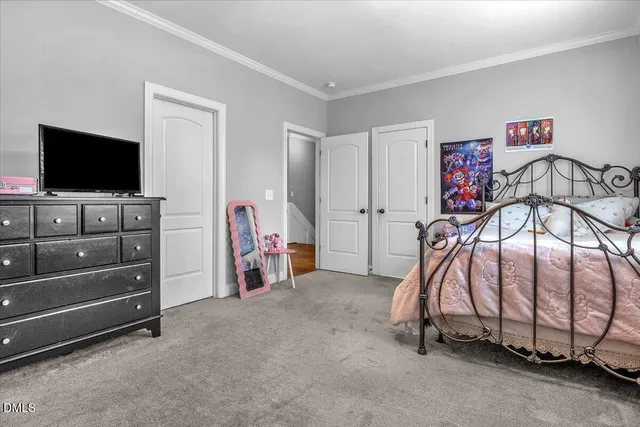 a view of a house with a patio and a yard