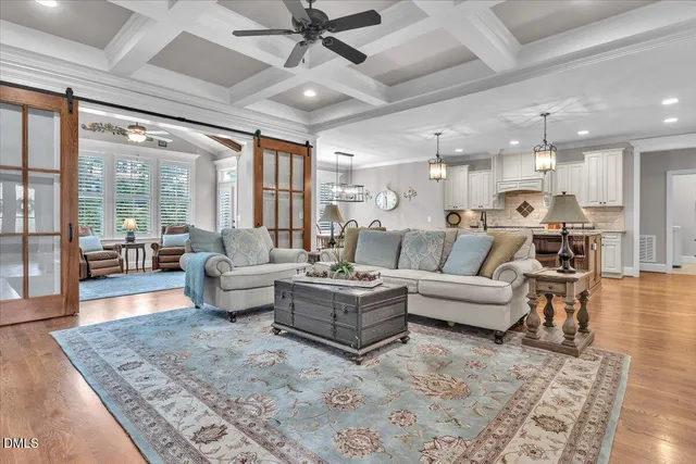 a kitchen with granite countertop a stove and white cabinets