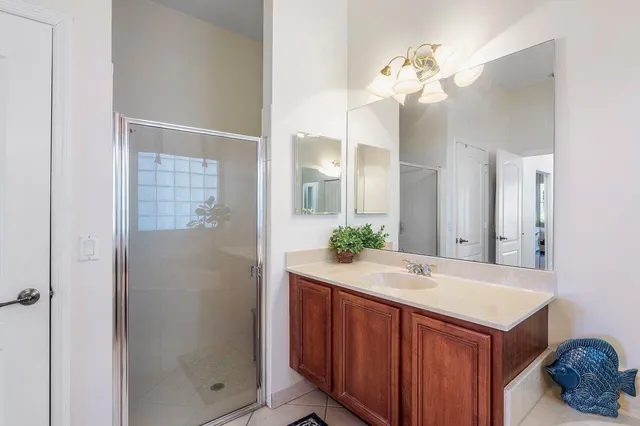 a bed sitting in a room next to a window