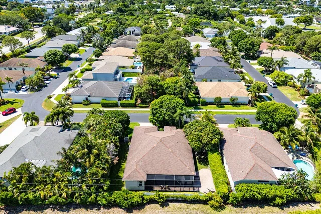 an aerial view of residential houses with outdoor space