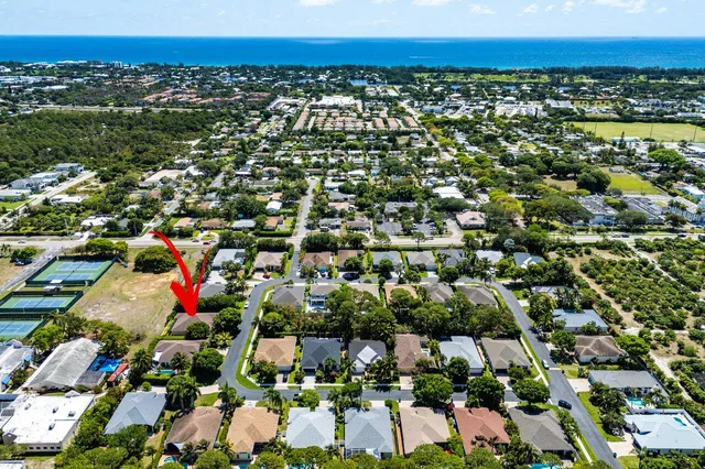 an aerial view of residential houses with outdoor space