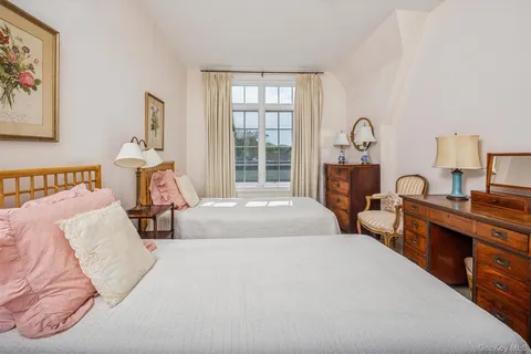 a bedroom with a bed and a table in it