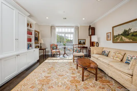 a living room with furniture and a rug