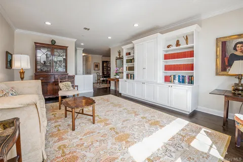a living room with furniture and a rug