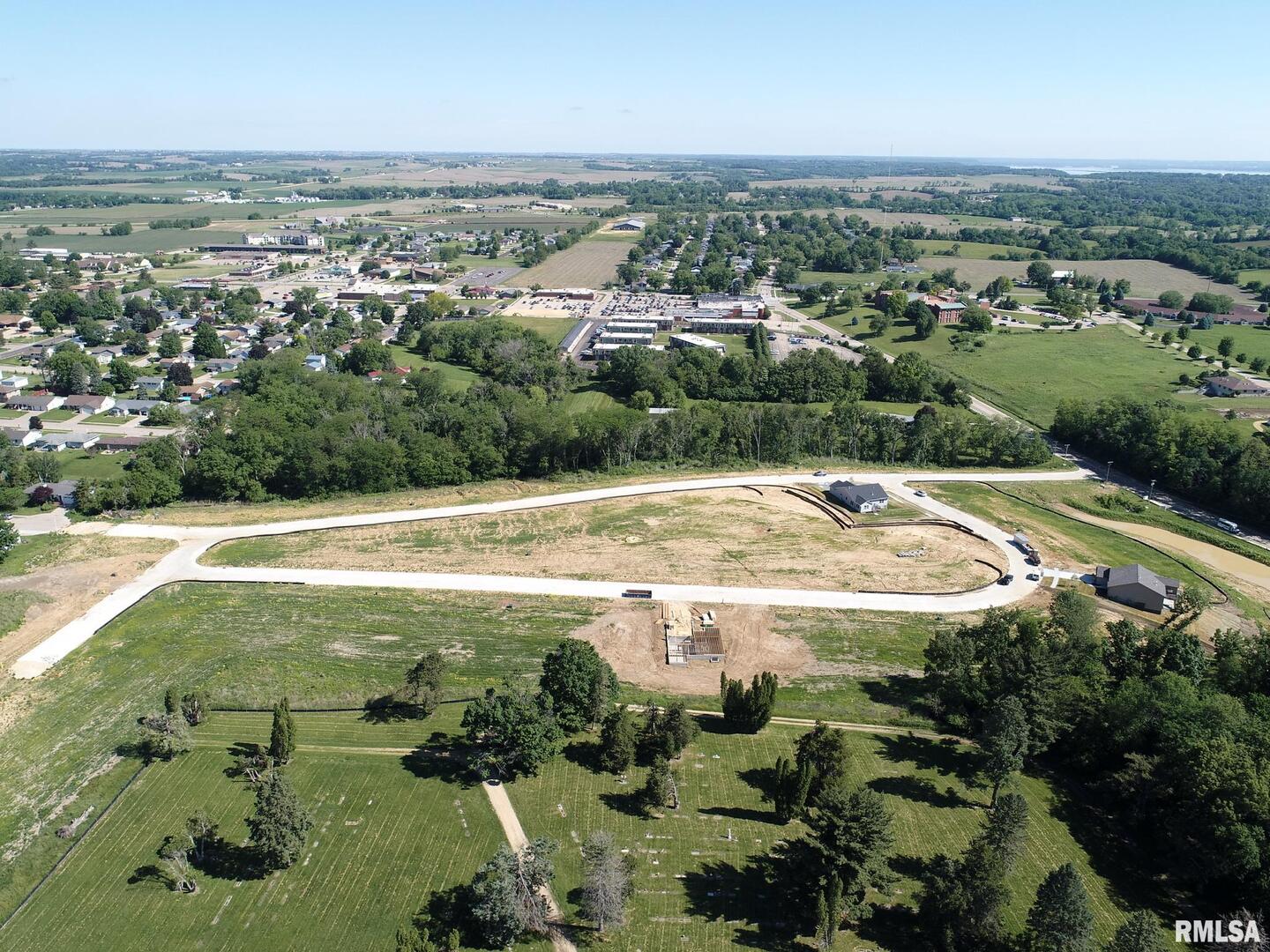 903 Riverstone Road Clinton, IA 52732 - Photo 3 of 4 an aerial view of residential houses with outdoor space