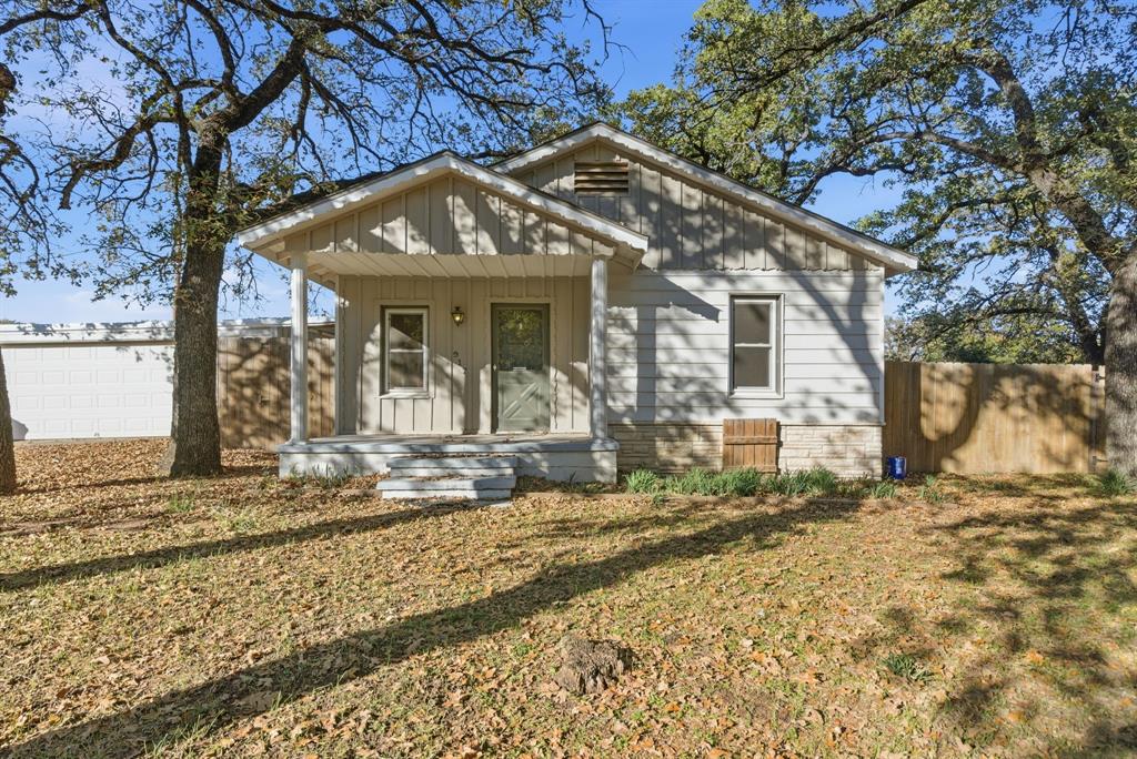917 Carpenter Street Azle, TX 76020 - Photo 1 of 40 a view of a house with snow on the wall