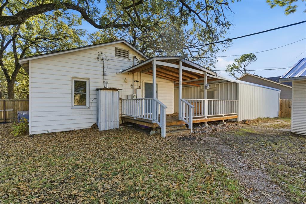 917 Carpenter Street Azle, TX 76020 - Photo 27 of 40 a view of a house with a yard