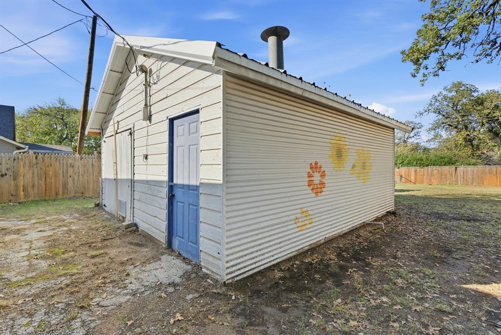 917 Carpenter Street Azle, TX 76020 - Photo 37 of 40 a view of a house with a yard