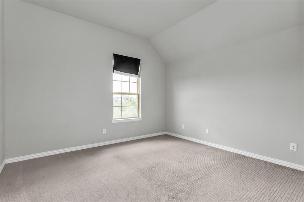 6333 Hall Road Frisco, TX 75034 - Photo 28 of 38 Windowed room featuring vaulted ceilings and light gray walls