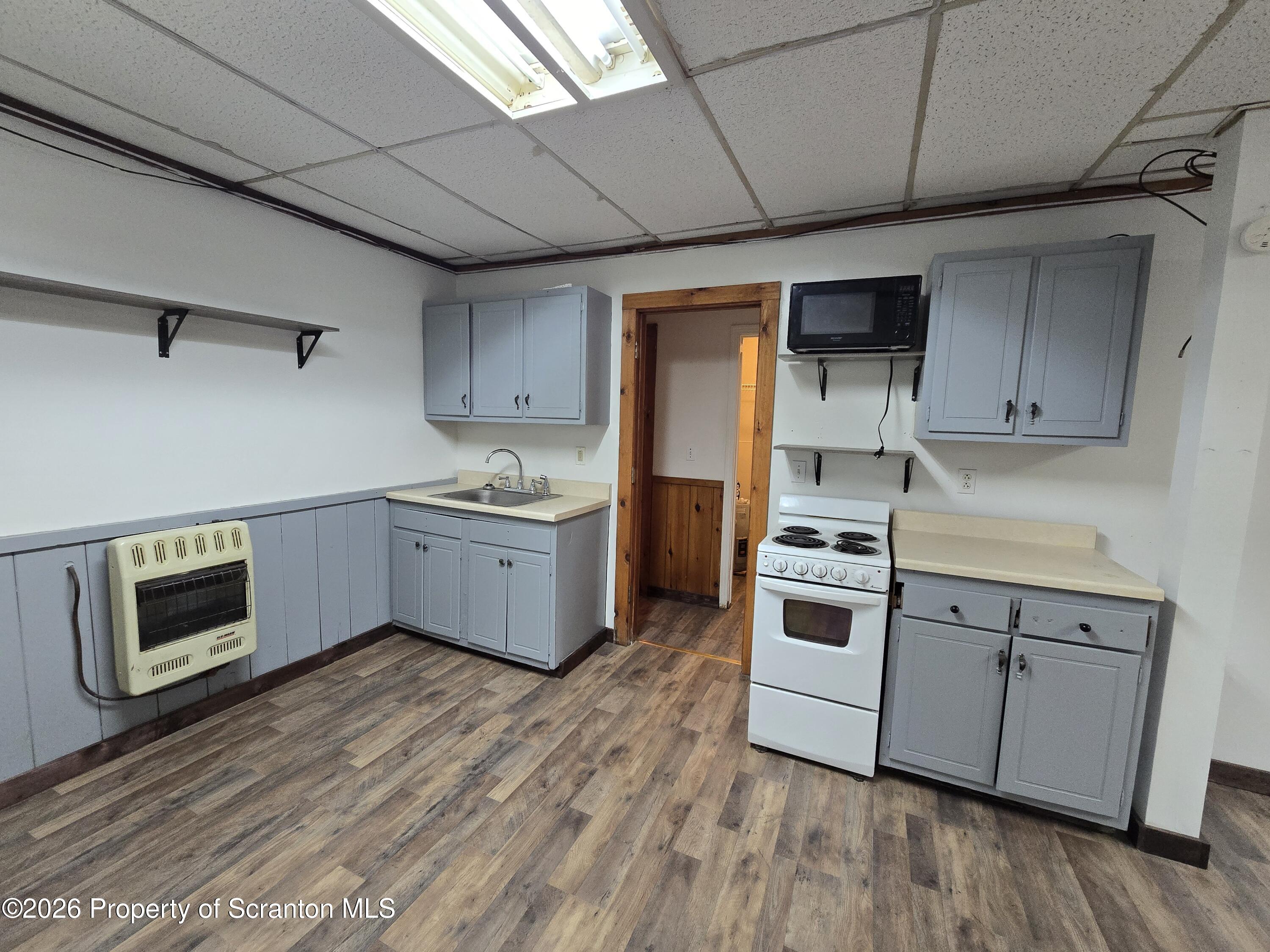 1025 Meshoppen Creek Road Tunkhannock, PA 18657 - Photo 11 of 24 a kitchen with stainless steel appliances a stove a sink and a refrigerator