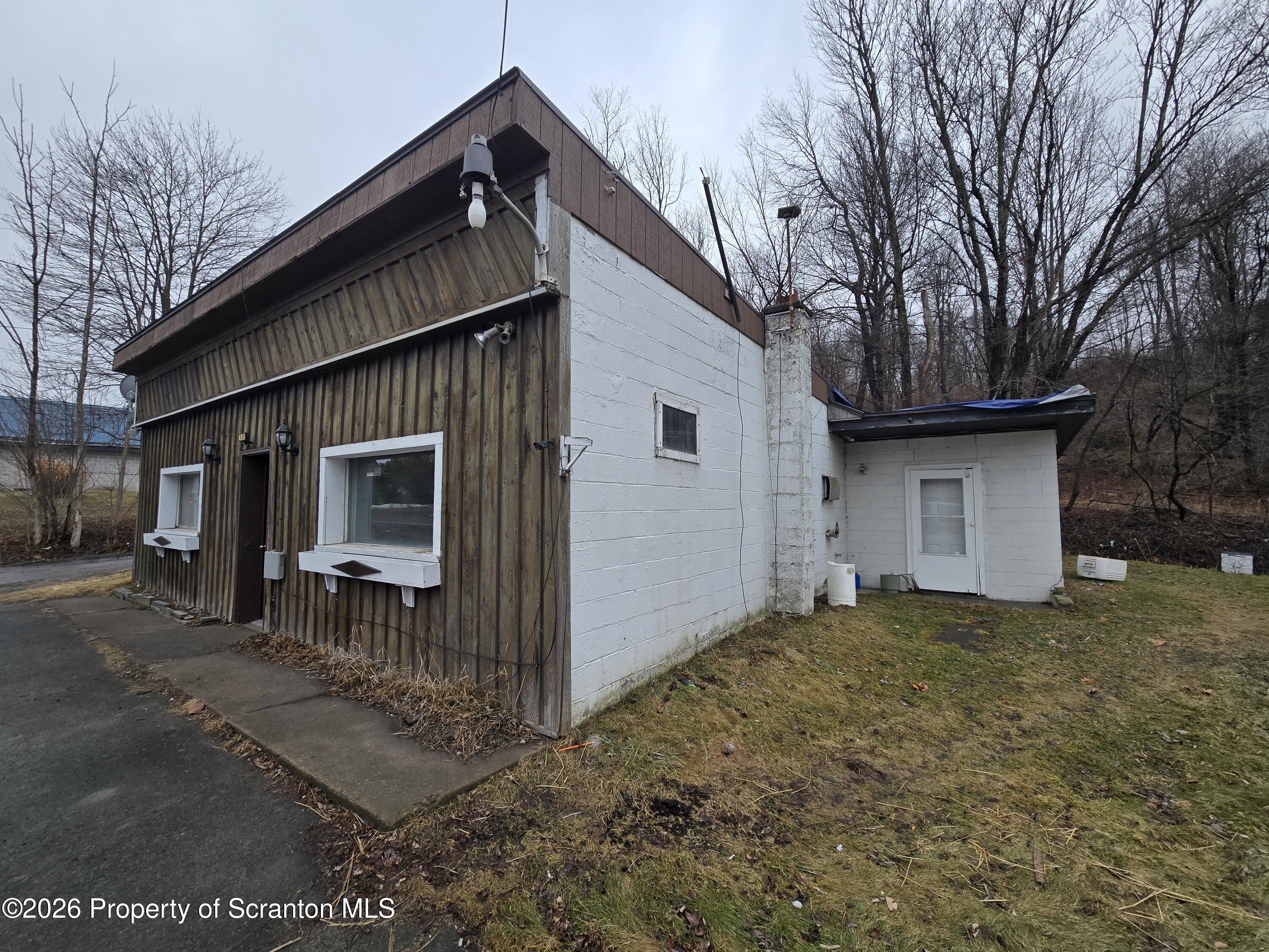 1025 Meshoppen Creek Road Tunkhannock, PA 18657 - Photo 6 of 24 a backyard of a house with large tree and wooden fence