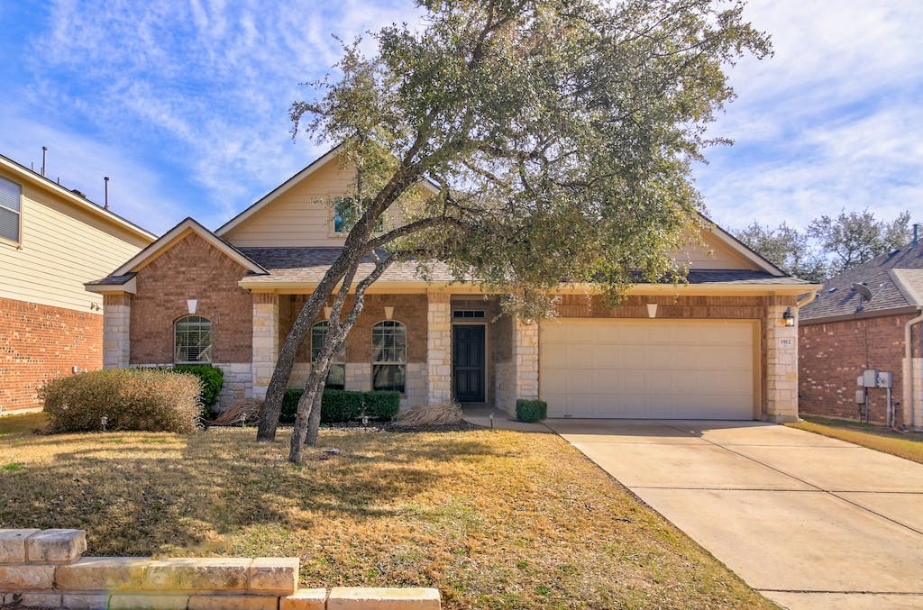 1912 Mary Ella Drive Leander, TX 78641 - Photo 1 of 1 a front view of a house with a yard
