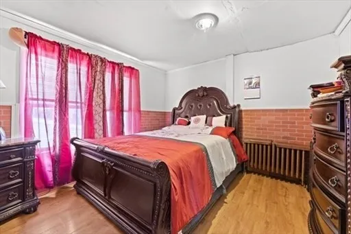 a bedroom with a bed and dresser