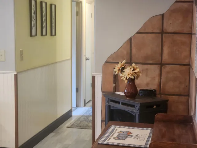 a room with a table and a potted plant