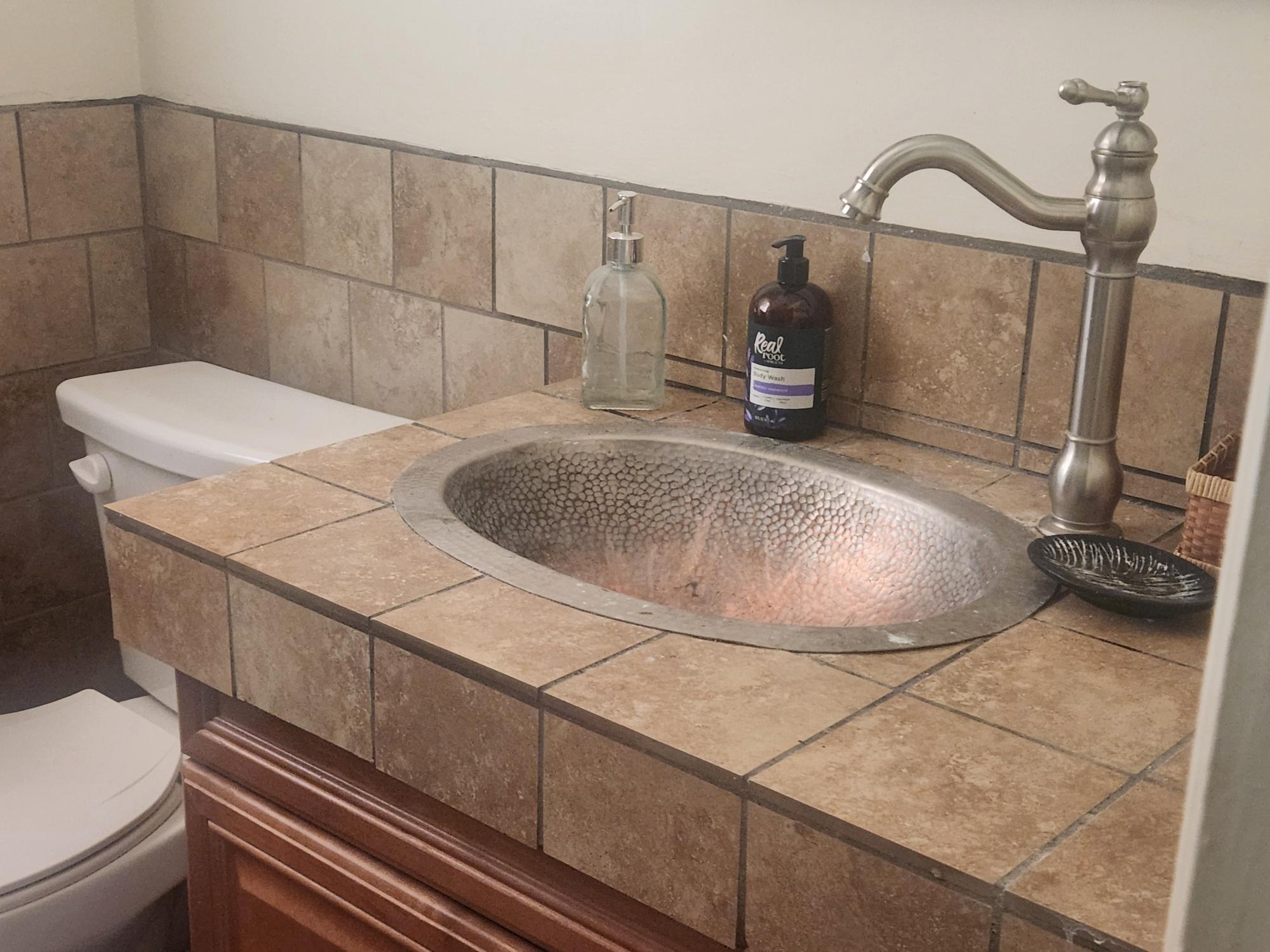 20263 Sugar Pine Street Burney, CA 96013 - Photo 12 of 22 a room with a sink and toilet