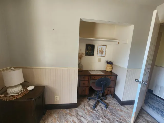 a bedroom with a bed and furniture