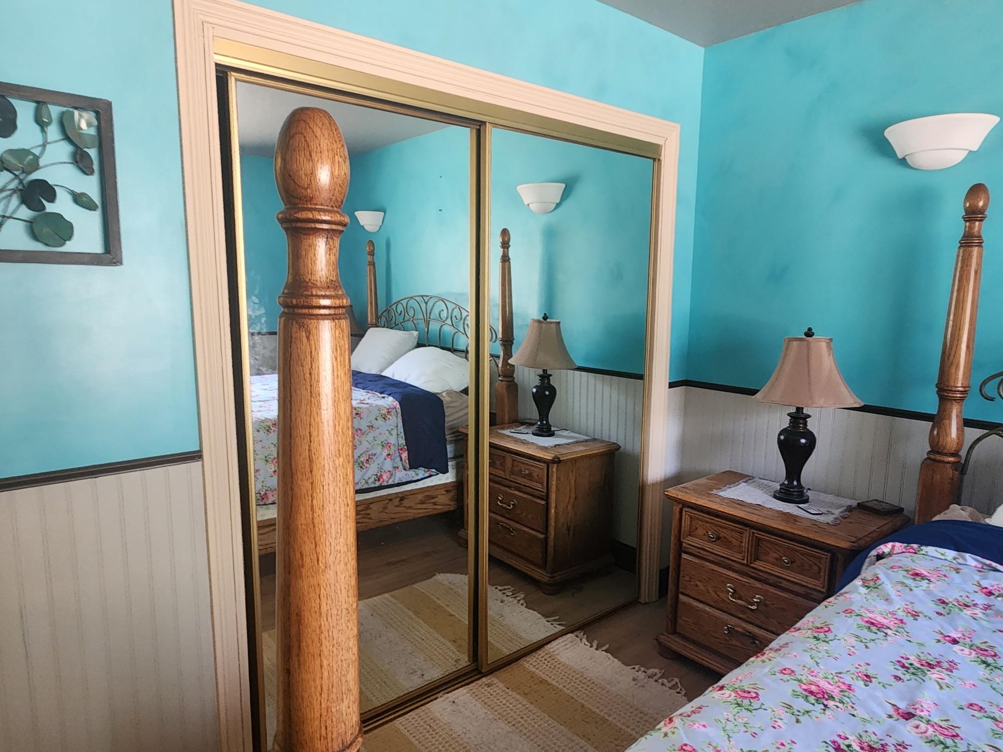 20263 Sugar Pine Street Burney, CA 96013 - Photo 16 of 22 a bedroom with a bed and furniture