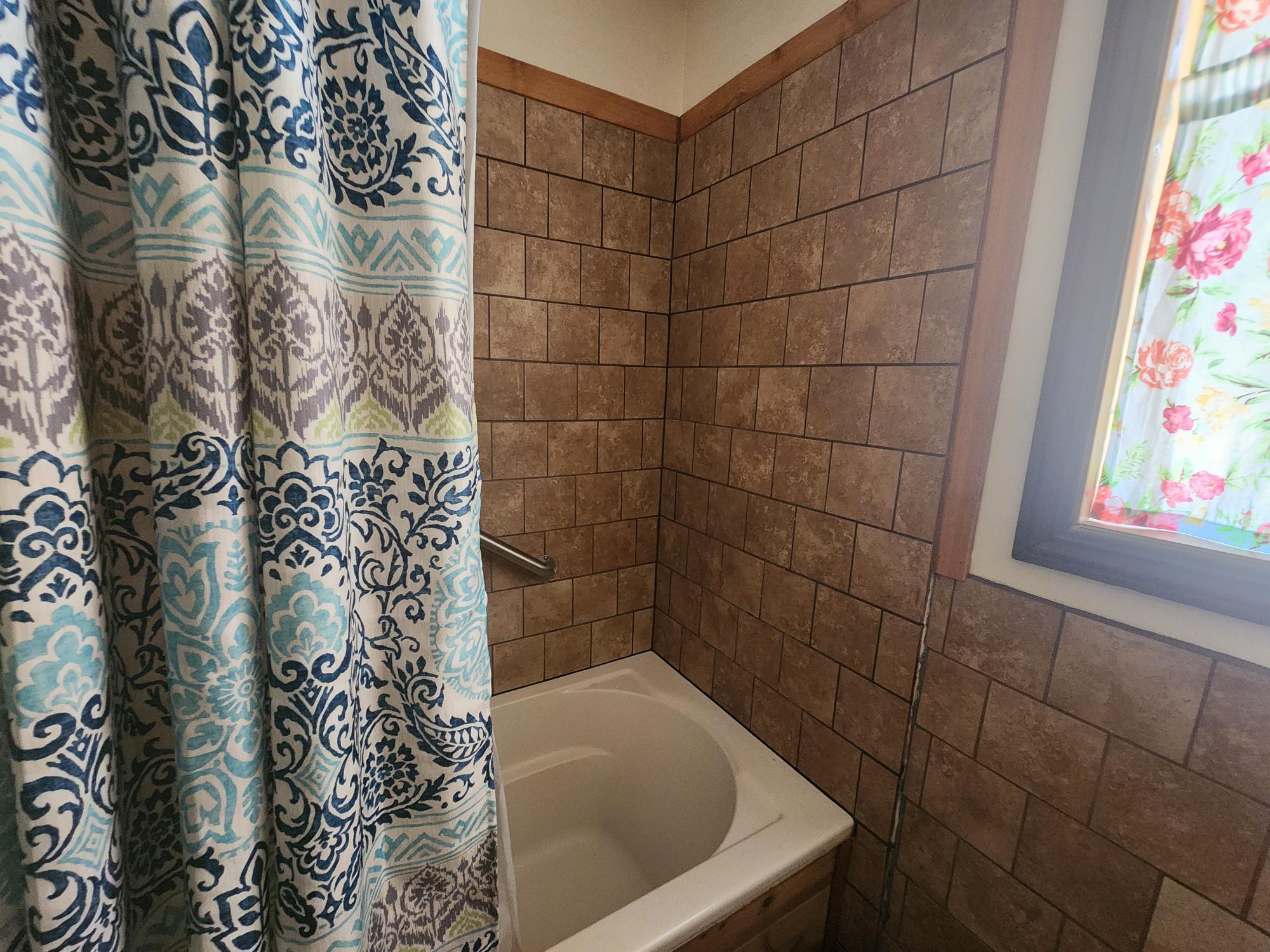 20263 Sugar Pine Street Burney, CA 96013 - Photo 17 of 22 a bathroom with a bathtub and shower