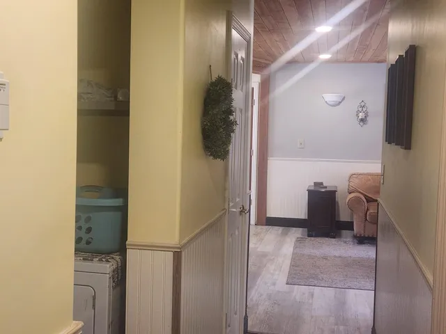 a view of a room that has a wooden floor